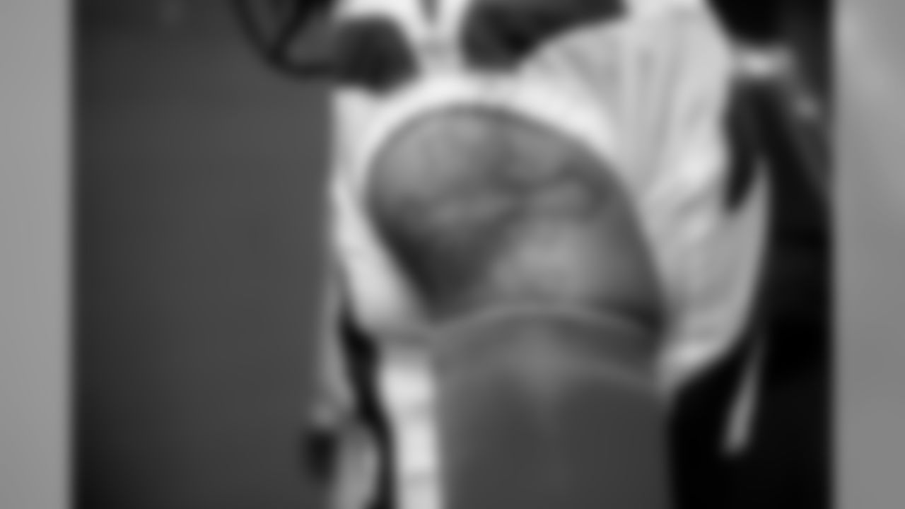 Earl Thomas' tattoo peeks out above his pink sleeve as he waits to leave the locker room for kickoff.