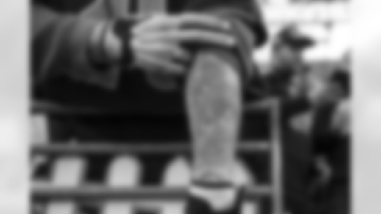 Seahawks fan Lorin Sandretzky shows off his latest tattoo - art of running back Thomas Rawls on his left forearm. Rawls had a breakout day, gaining 255 all-purpose yards and two touchdowns.