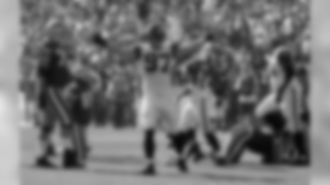 Patrick Kerney celebrates his 50-yard fumble return.