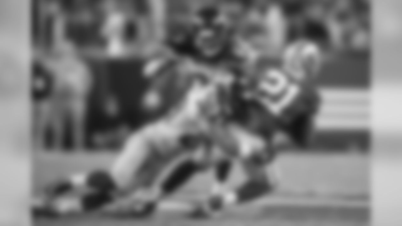 Earl Thomas tackles San Francisco's Frank Gore as Richard Sherman comes in to help finish the job. The Seahawks defense held the 49ers ground game to only 64 yards rushing.