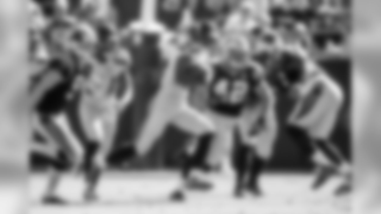 Kick returner Paul Richardson splits the Panther's coverage team and sprints past kicker Graham Gano on his way to a 47-yard return that led to a Seattle field goal.