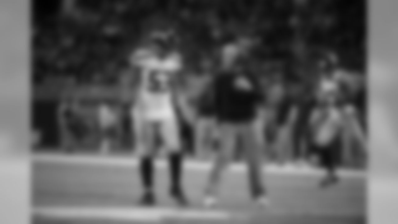 Linebacker Malcolm Smith gets instructions from head coach Pete Carroll during a timeout late in the game.