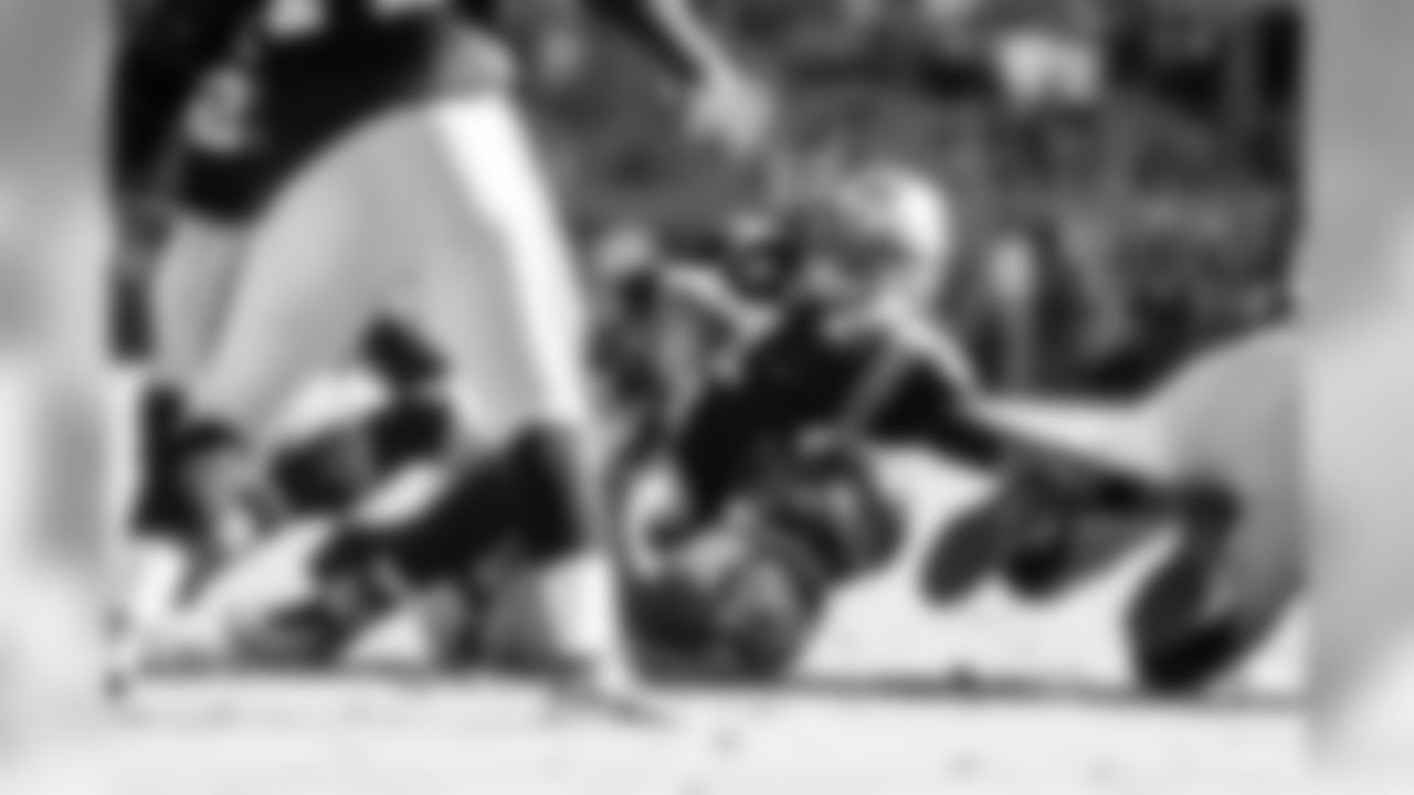 Seahawks defender Bruce Irvin records the first of his two sacks of Carolina quarterback Cam Newton in the final minute, helping to seal the road win for Seattle.