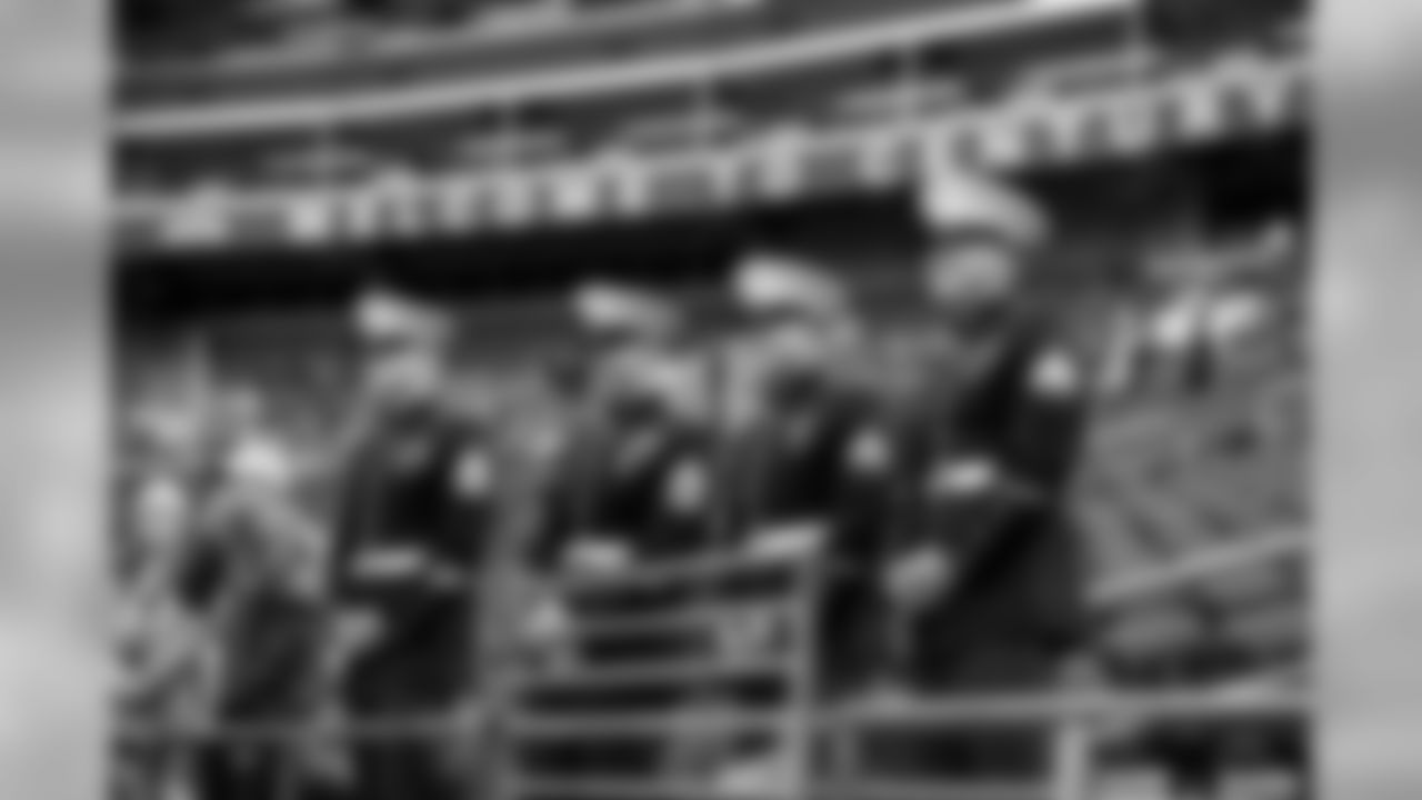 U..S. Marines in dress blues watch early pregame warmups from the front at CenturyLink Field as the N.F.L. and the Seahawks honored the military during Sunday's "Salute to Service."