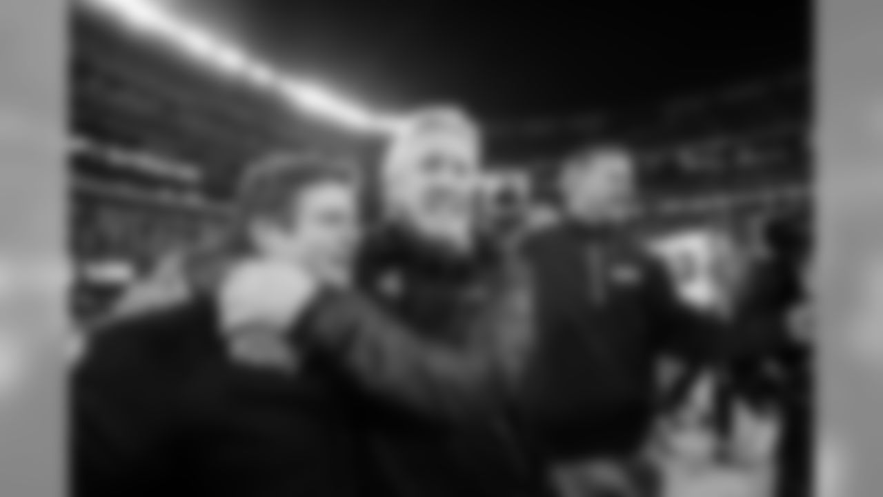 Pete Carroll hugs general manager John Schneider during the two-minute warning.
