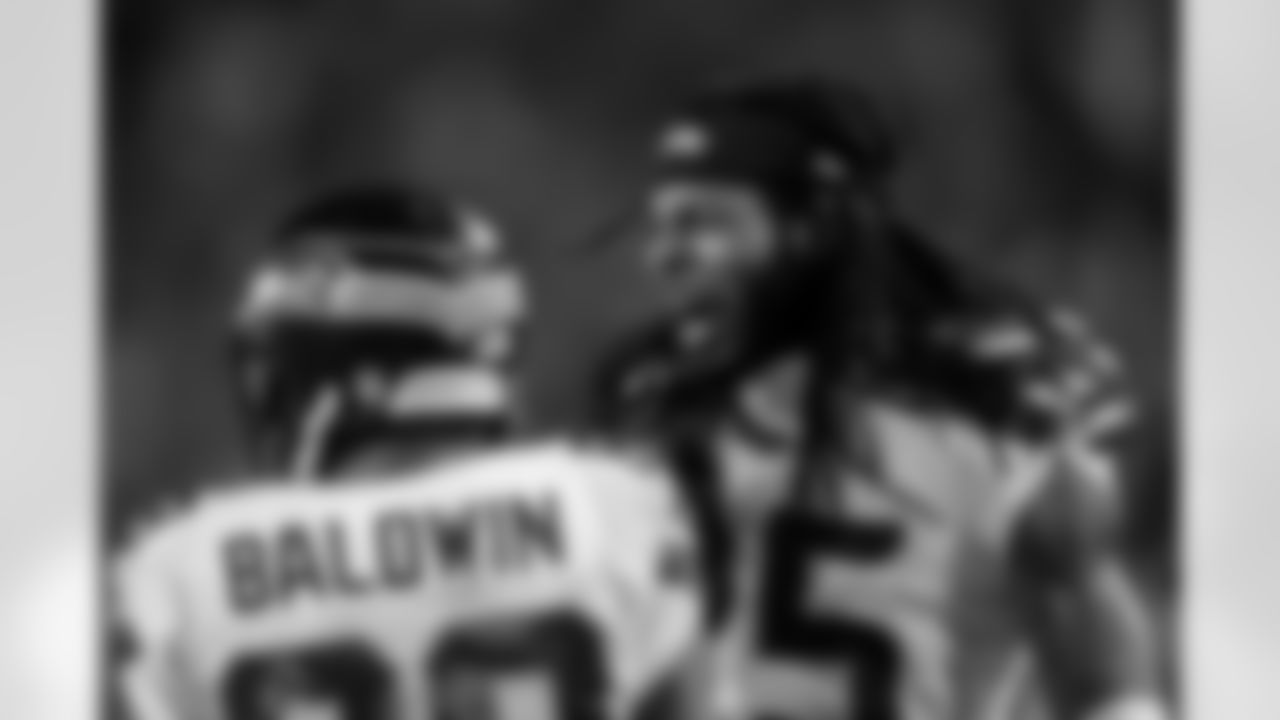 Richard Sherman raced down the sideline to celebrate with Baldwin after the long catch.