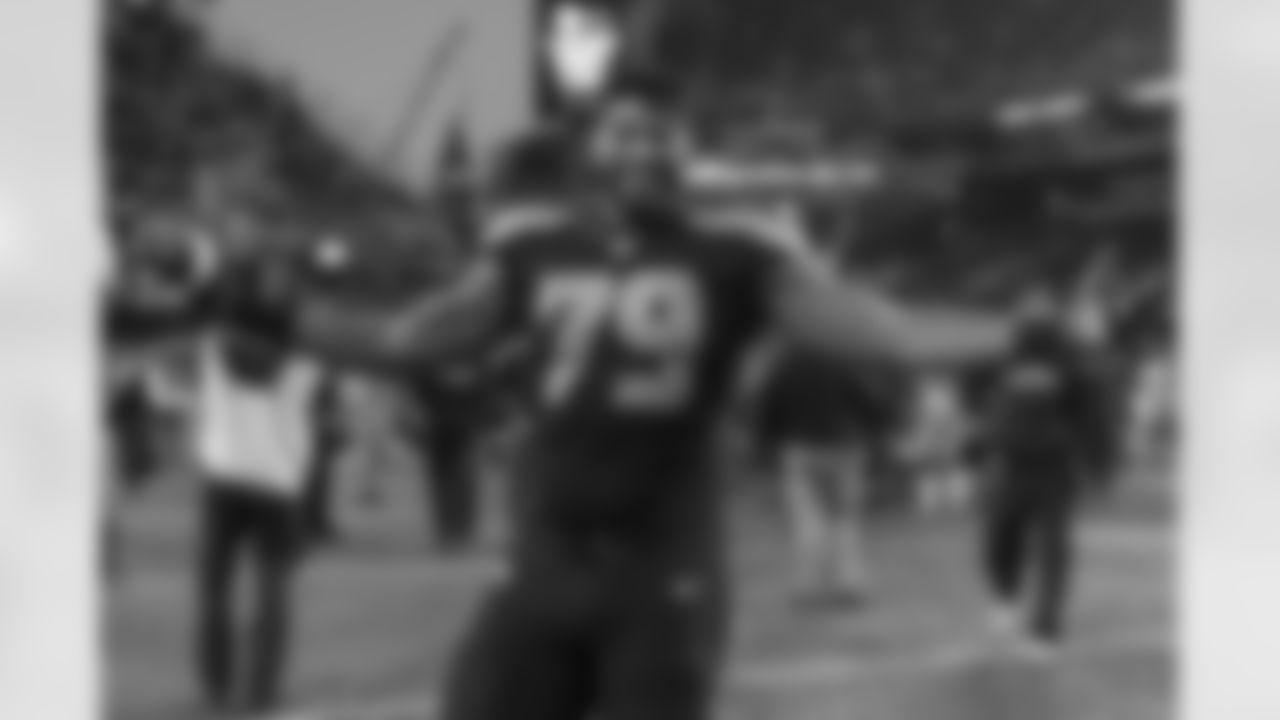 After the game, offensive right tackle Garry Gilliam was all smiles as he walked off the field.