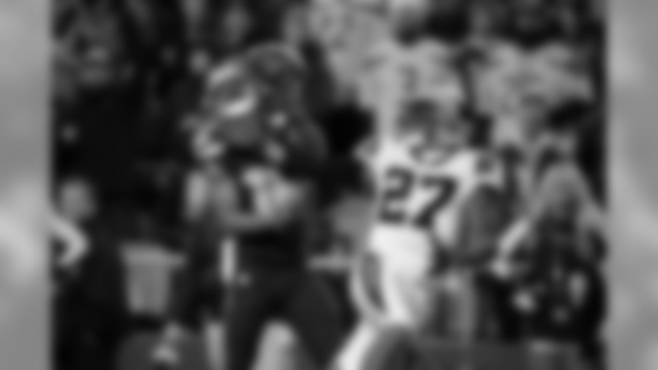 Seattle's Tyler Lockett gets a hand on a deep ball from Russell Wilson but is unable to hang on as Carolina's Robert McClain defends.