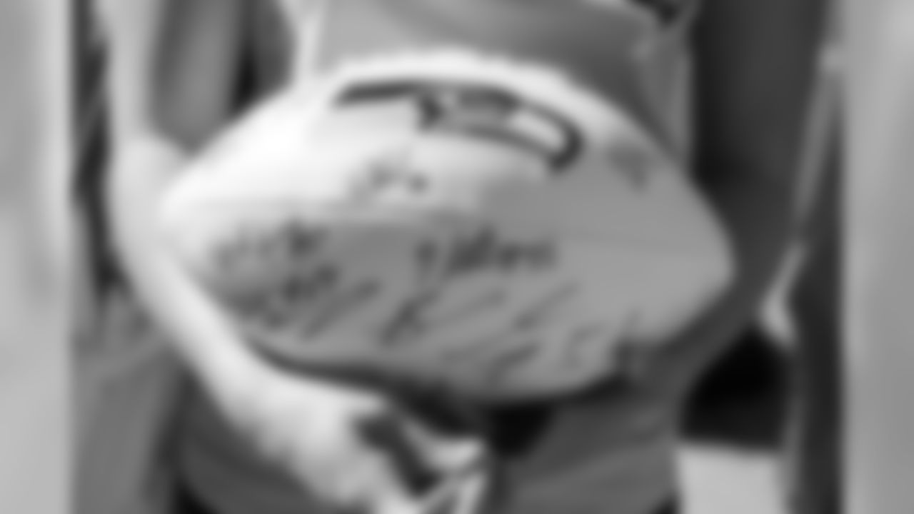 Autographs from Seahawks players and coaches adorn this souvenir football.