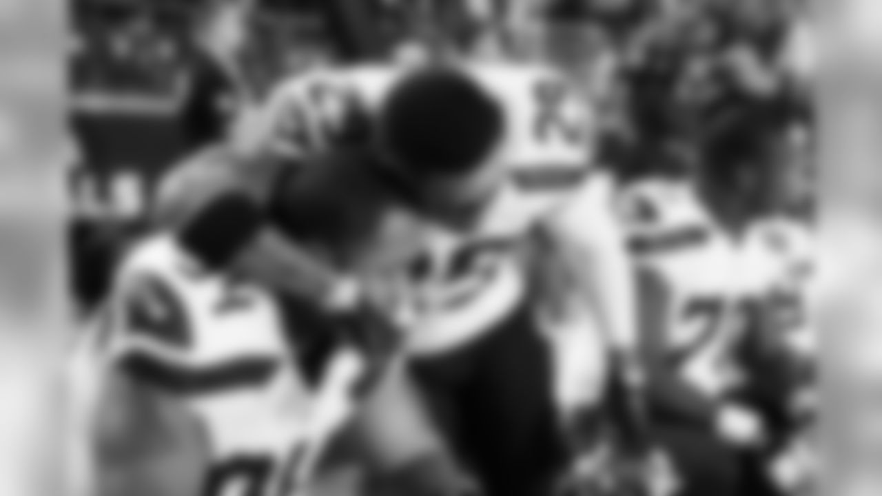 Safety Earl Thomas, so instrumental in the team's philosophy of "Love Our Brothers", hugs teammate Kevin Williams in the moments before kickoff.