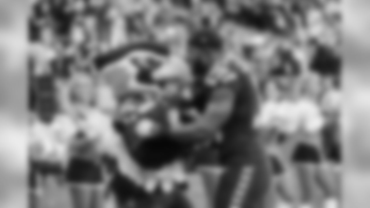 "Bltiz" greets Kam Chancellor after the game as Chancellor makes his way to the locker room.