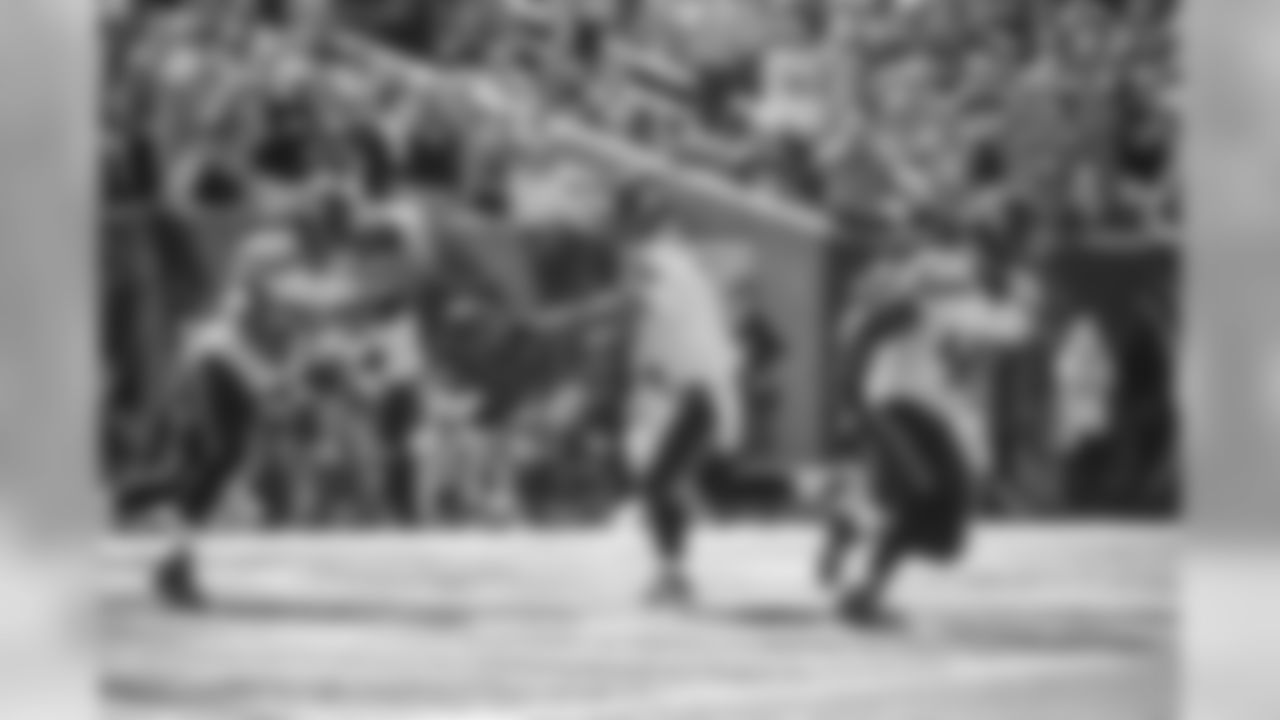 Russell Wilson hands off to running back Thomas Rawls with fullback Derrick Coleman leading the way after a punt pinned the Seahawks deep in their own territory,
