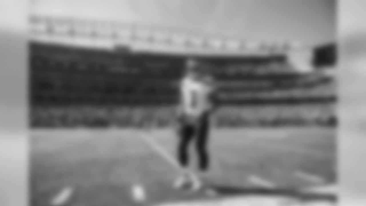 Quarterback Russell Wilson walks on the sideline before kickoff.