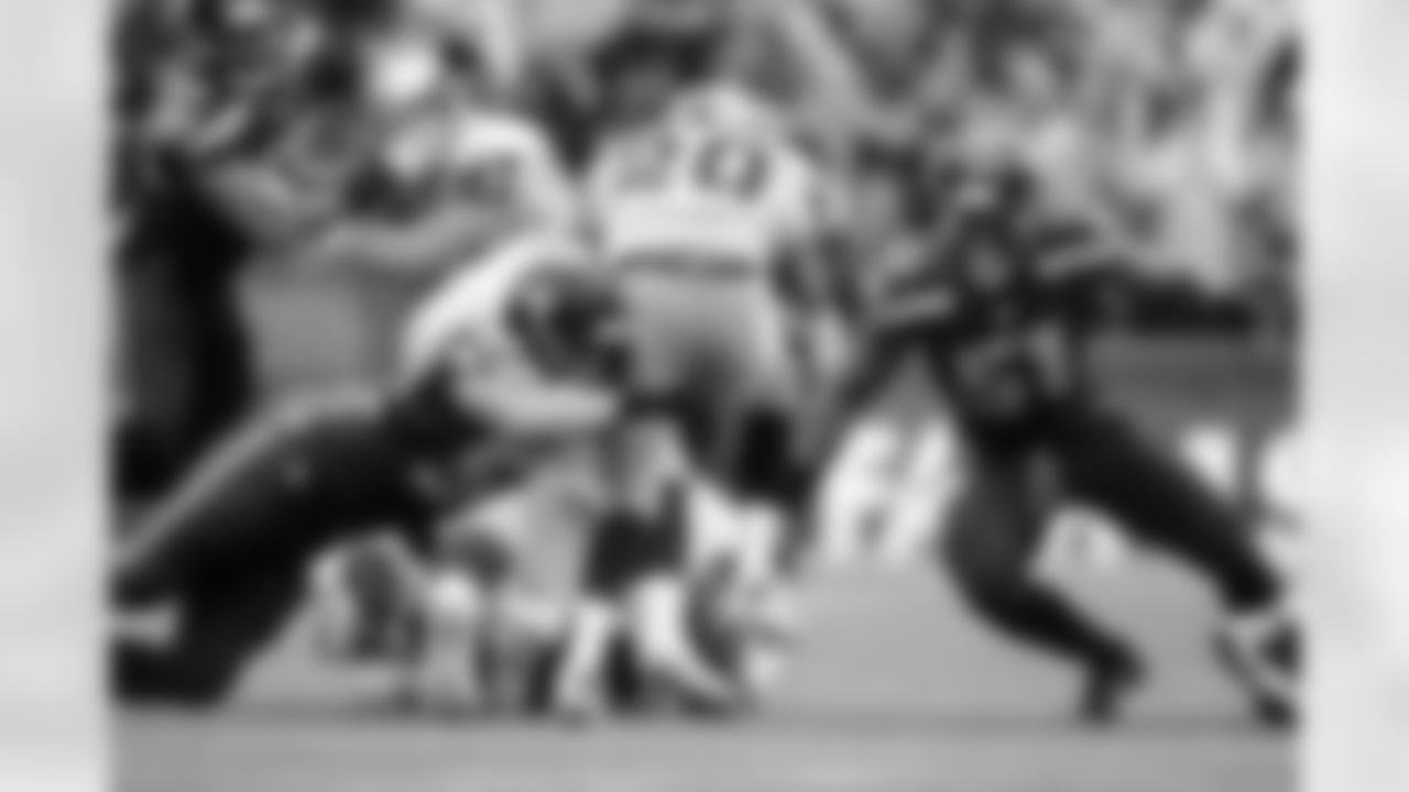 Linebackers Brock Coyle and Bruce Irvin combine to stop Oakland's Darren McFadden in the first quarter. Seattle held the Raiders to only 37 yards rushing on the day.
