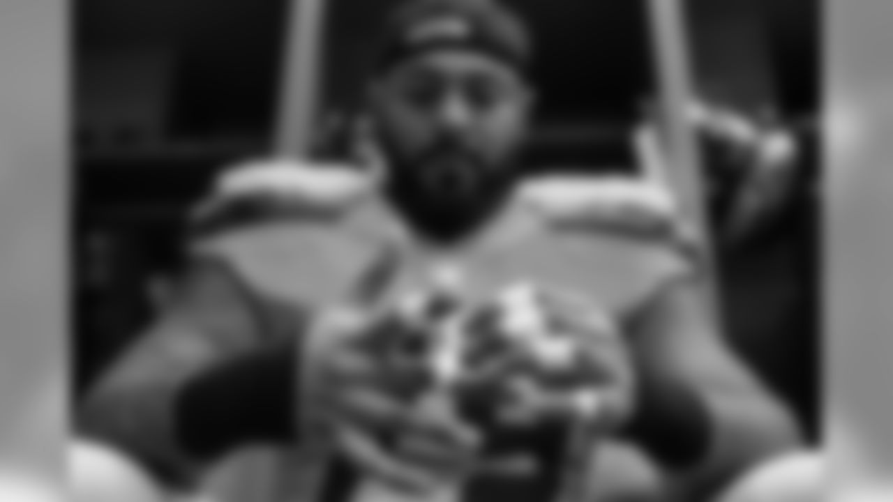 Offensive tackle Garry Gilliam methodically tapes his fingers before taking the field.