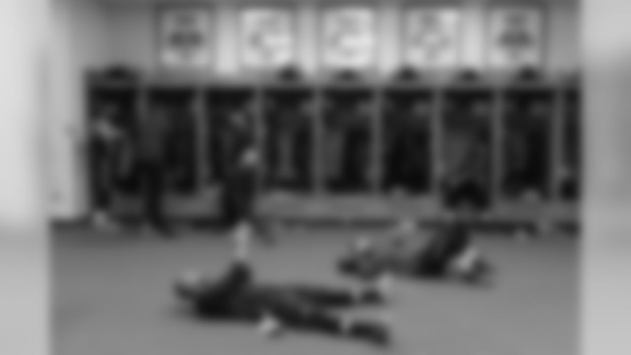 Receivers Doug Baldwin and Jermaine Kearse get loose on the floor of the locker room before taking the field for pregame warmups.