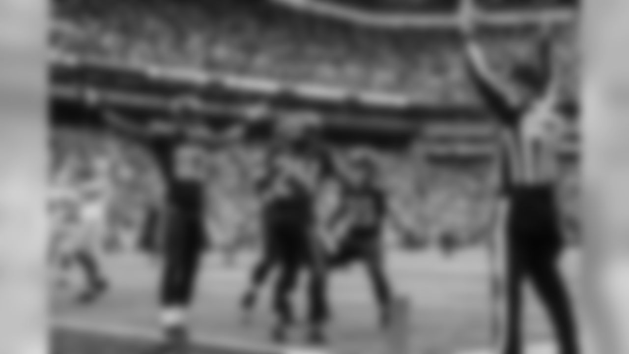 Ricardo Lockette and the official signal touchdown as Marshawn Lynch is congratulated on his touchdown run. The scoreboard clock reflects 1:25 left in regulation.