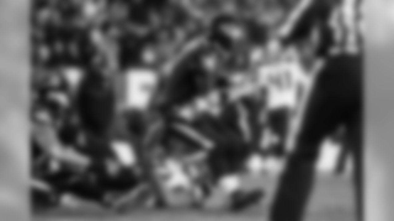 Seahawks defensive end Michael Bennett was on his back on the ground but managed to use his right hand to sack Philadelphia's Mark Sanchez for a five-yard loss to open the fourth quarter.