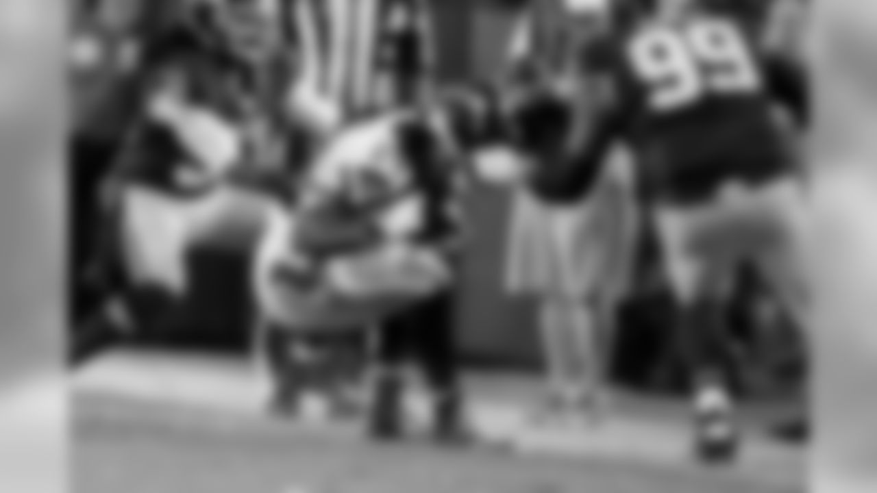 Seattle's Marshawn Lynch gets his helmet ripped off on a run along the sideline, resulting in a personal foul face-mask penalty on Washington.