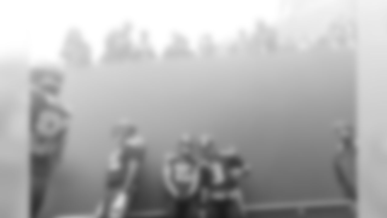 Pressure? None here. Russell Wilson and Jermaine Kearse find a moment to pose for a photo amid the fog and bedlam of pregame introductions.