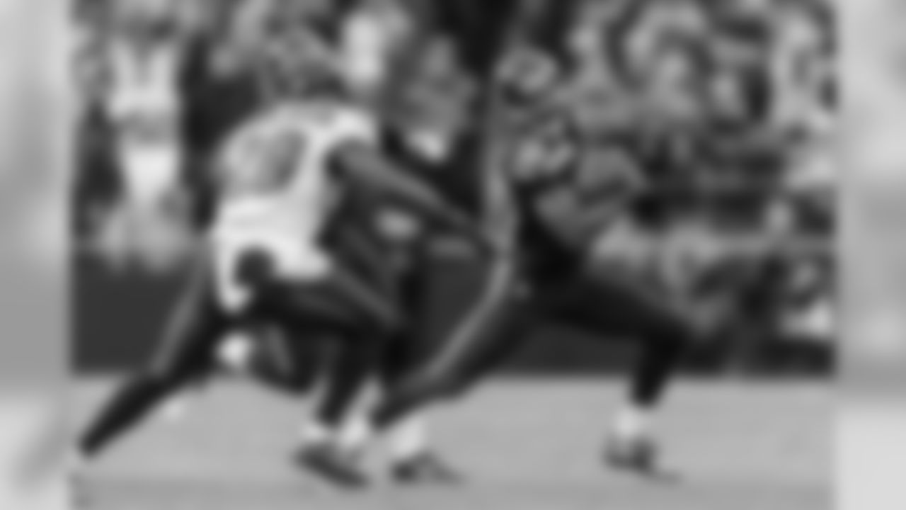 Seattle's Tyler Lockett looks for running room on a punt return in the third quarter.