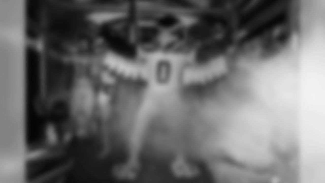 Blitz stands with the team in the tunnel before the start of the game.