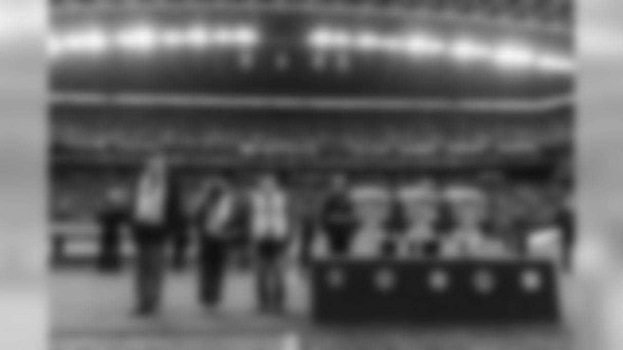 Military veterans stand next to three of six camouflaged seats that the Seahawks have dedicated as "Heroes of 12" stadium seats. The seats will be designated for local military to attend each home game.