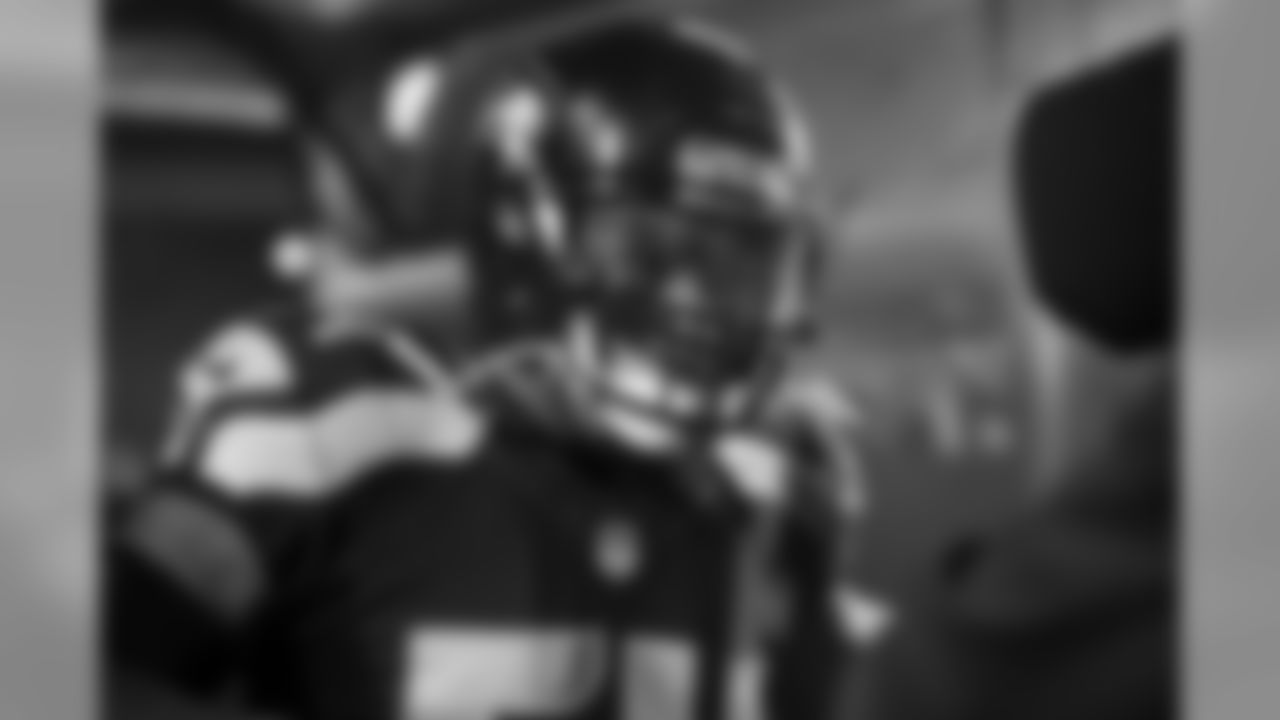 Linebacker Bobby Wagner stares into a television camera as he waits for his name to be called.