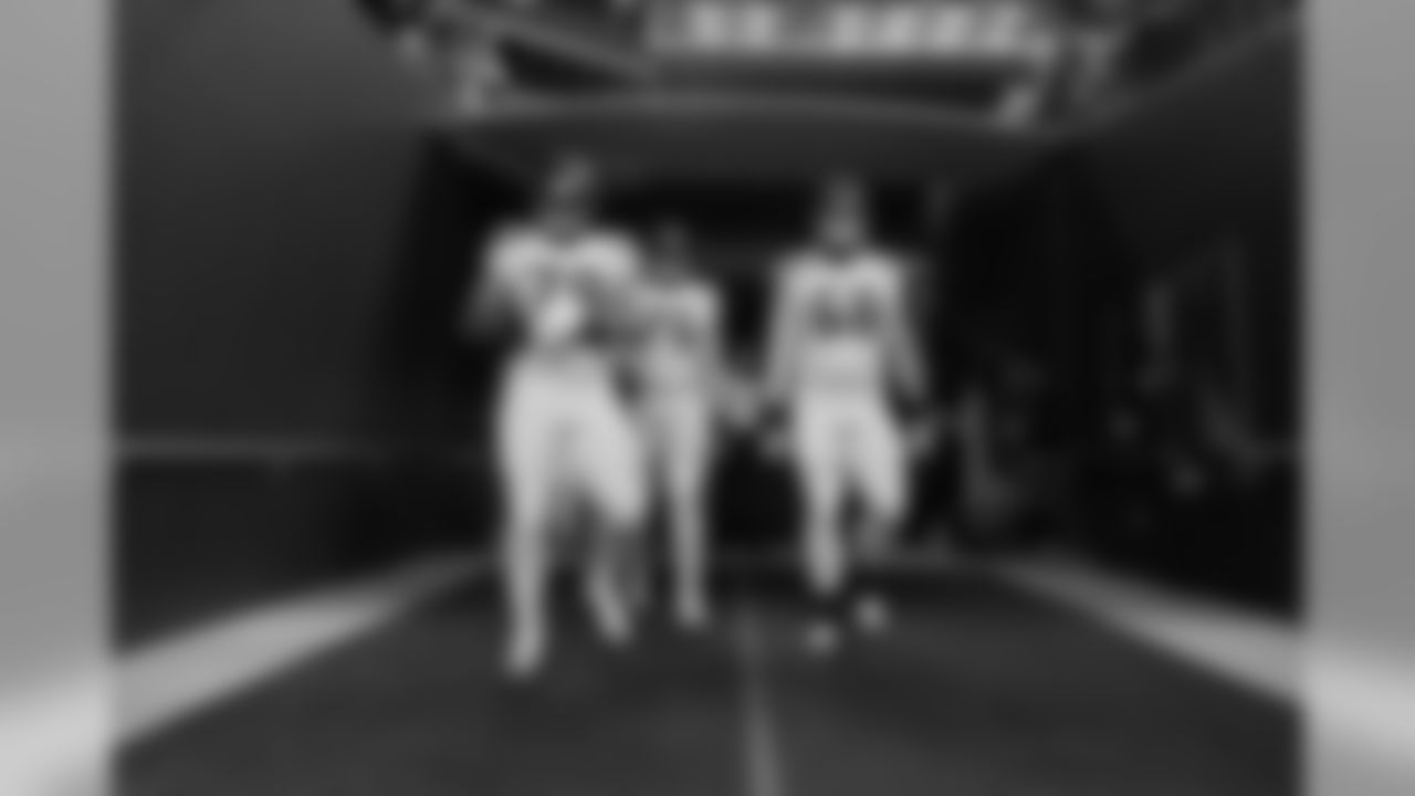 Garry Gilliam, Germain Ifedi and Justin Britt come out of the tunnel before the game.