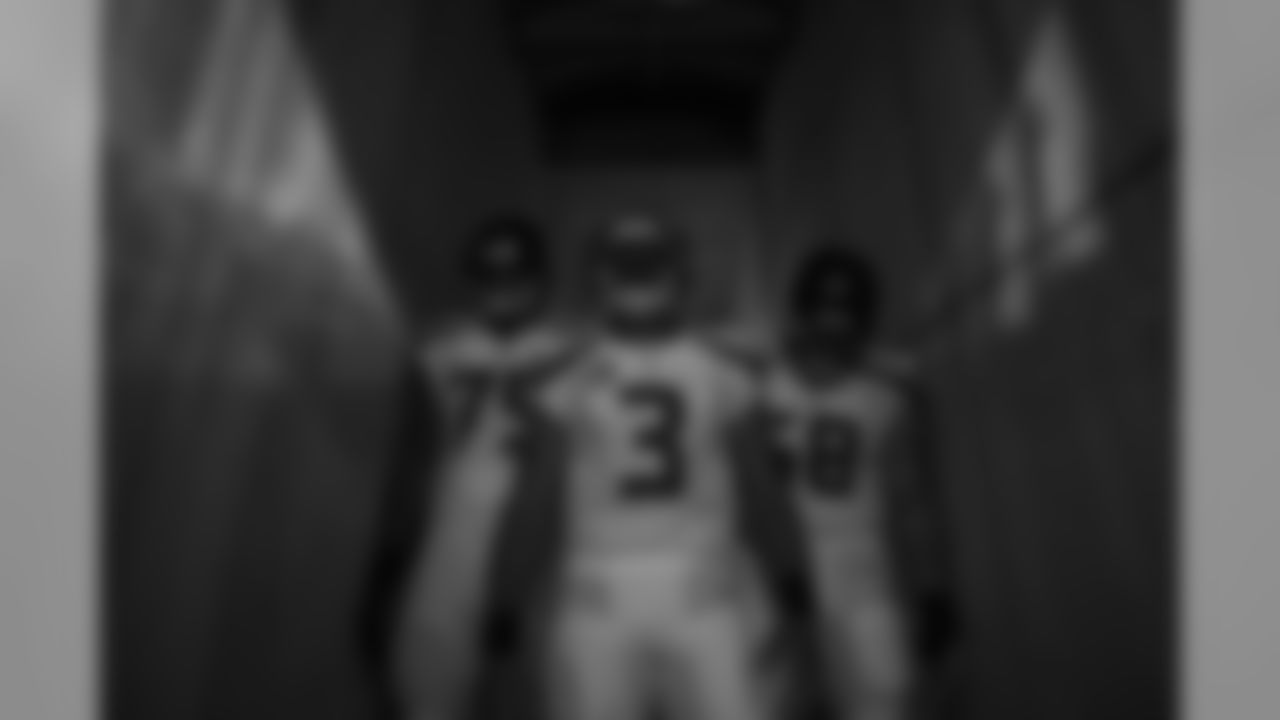 Quarterback Russell Wilson leads the Seahawks down narrow tunnel beneath the stands at Lambeau Field for pregame introductions.
