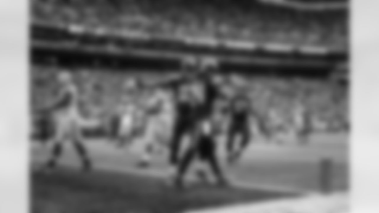 Ricardo Lockette and J.R. Sweezy come to celebrate after Marshawn Lynch scored on a 24 yard run. The scoreboard clock reflects 1:25 left in regulation and the score has not yet been changed to reflect Seattle's 20-19 lead.