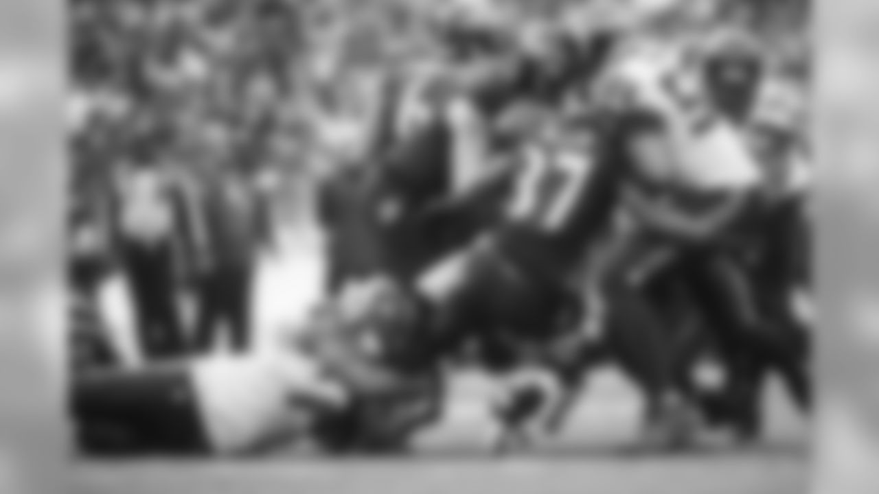 Michael Bennett doesn't let go of Baltimore's Javorius Allen and K.J. Wright finished the tackle.