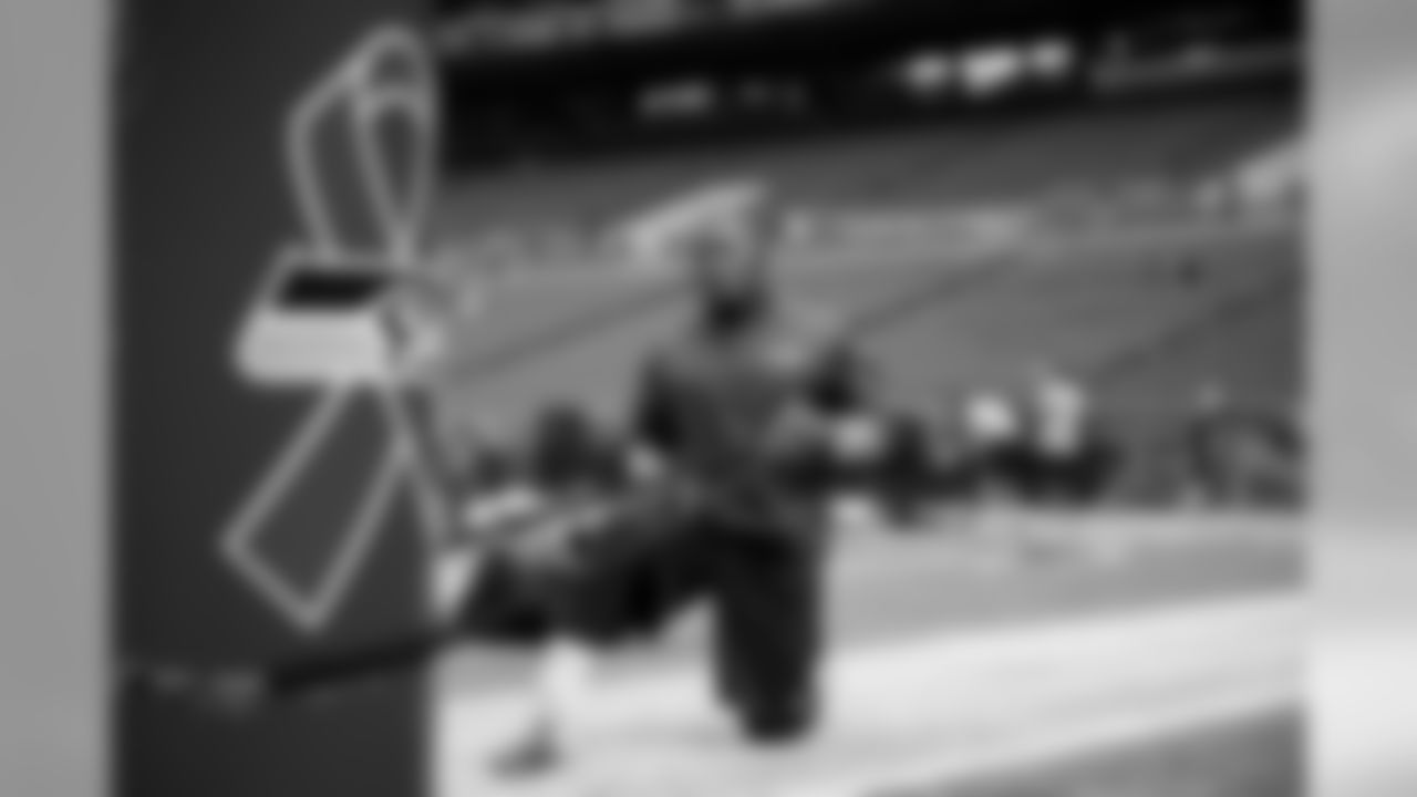 Seahawks fullback Derrick Coleman stretches in the hours before kickoff. CenturyLink Field was decked in pink for the NFL's salute to Breast Cancer Awareness Month.