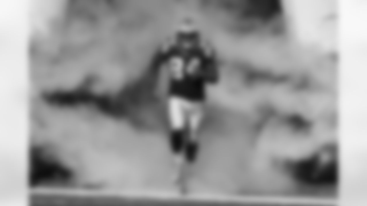 Carolina Panthers tight end Ed Dickson (84) runs onto the field during player introductions before an NFL regular season football game against the Minnesota Vikings on Sunday, Dec. 10, 2017 in Charlotte. The Panthers won, 31-24. (Ric Tapia via AP)