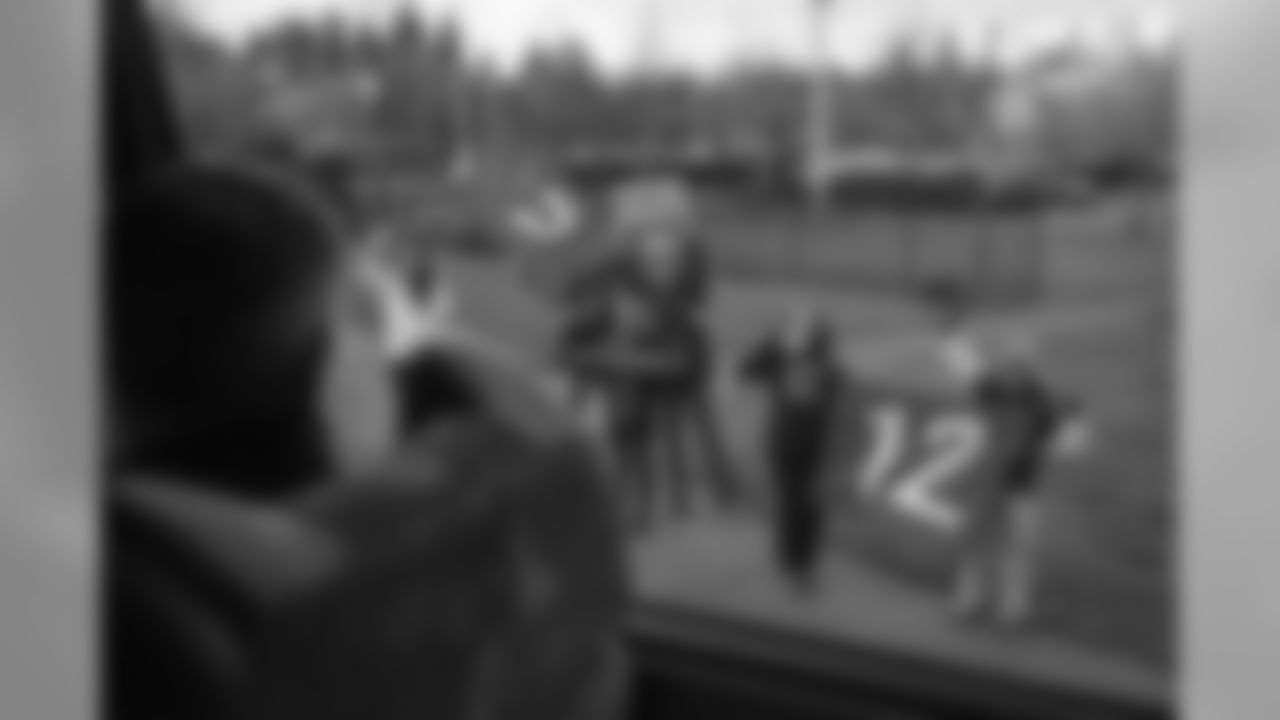 Seahawks fans are always on hand when the charter buses leave the interstate and head through Sea Tac to the airport for departure.