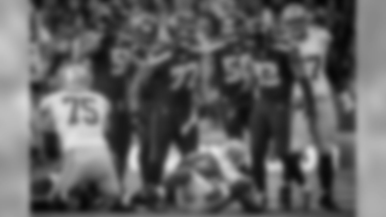 San Francisco's Frank Gore is surrounded by Seahawks defenders Bruce Irvin, Bobby Wagner, Michael Bennett and O'Brien Schofield after being tackled.