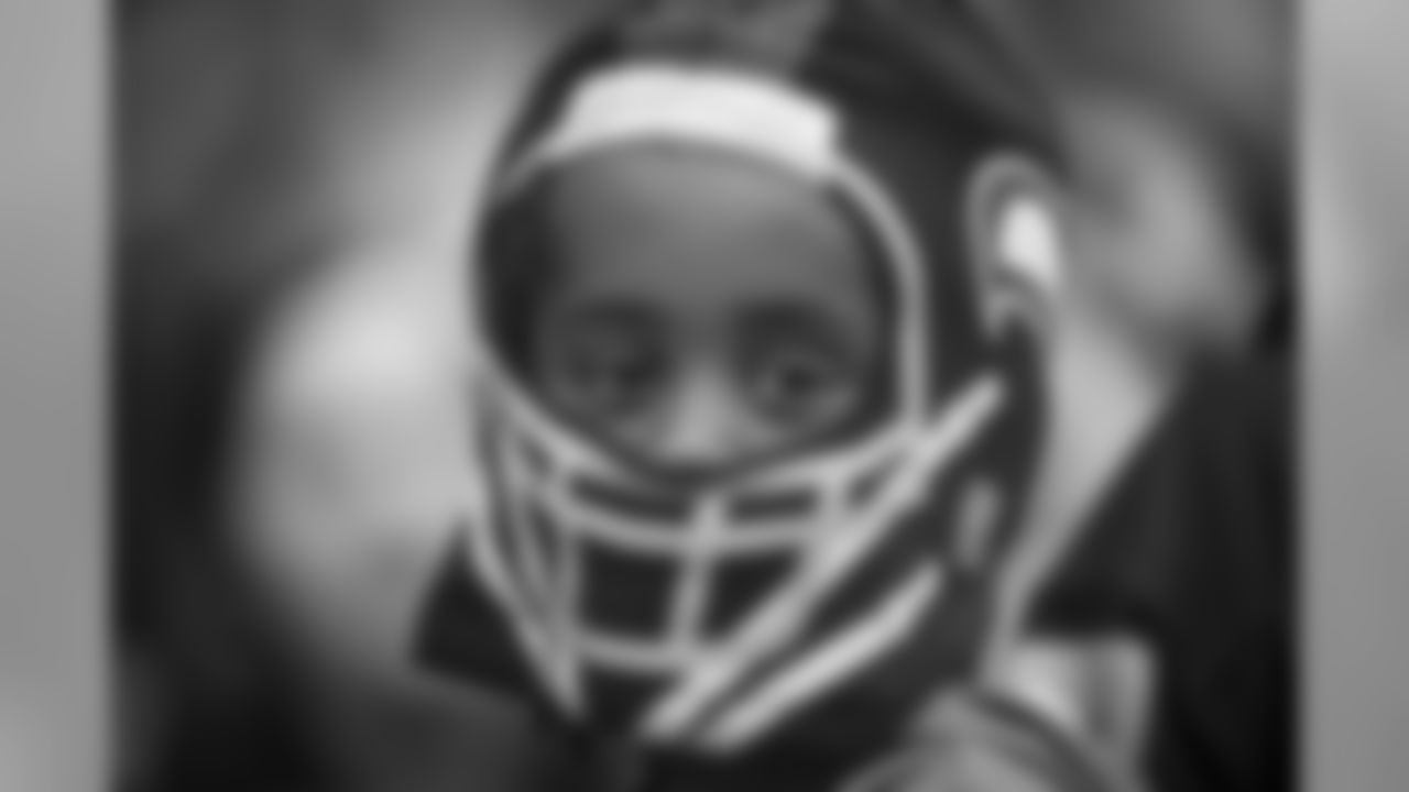 This young fan proudly peeks out of his "helmet hat" at CenturyLink Field.