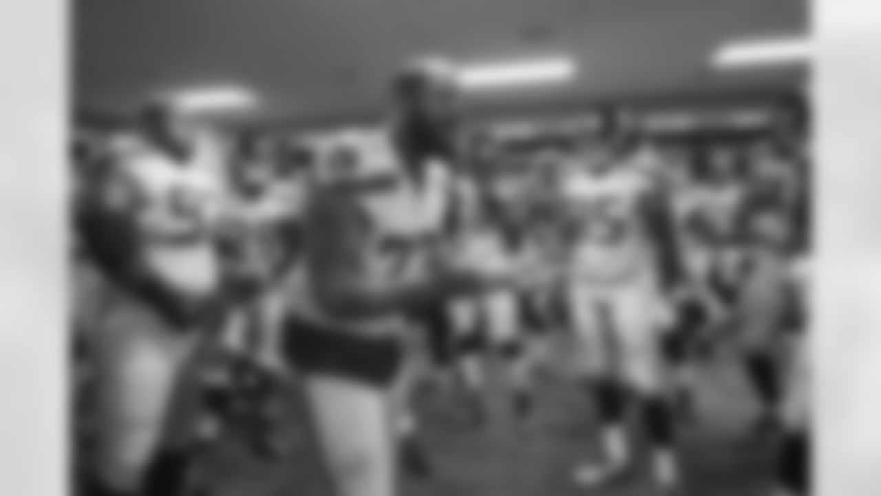 Michael Bennett talks to his teammates just before the Seahawks take the field for pregame introductions.
