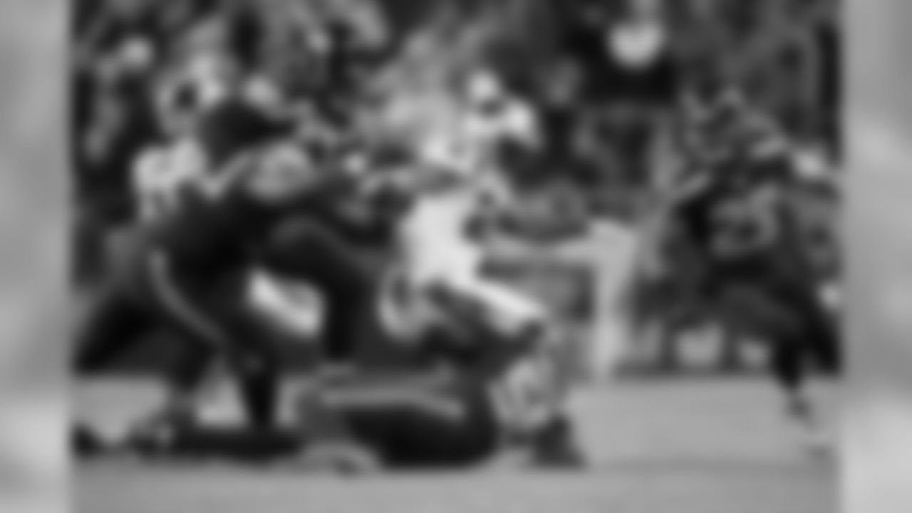 Seattle's K.J. Wright causes Carolina's Jonathan Stewart to fumble in the second quarter.