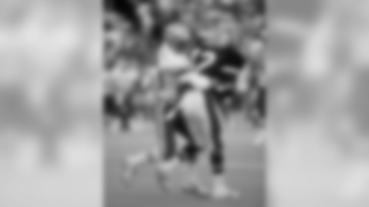 Seattle Seahawks Hall of Fame wide receiver Steve Largent (80), playing for the AFC, knocks a potential interception away from San Francisco 49ers Hall of Fame cornerback Ronnie Lott (42), playing for the NFC, during the NFL Pro Bowl, a 15-6 AFC victory o (AP Photo/NFL Photos)