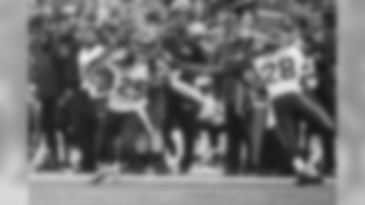 Richard Sherman attempts to head upfield after intercepting a pass intended for Ravens receiver and former Seahawk Chris Matthews, but Matthew grabs him by the hair and doesn't let go.