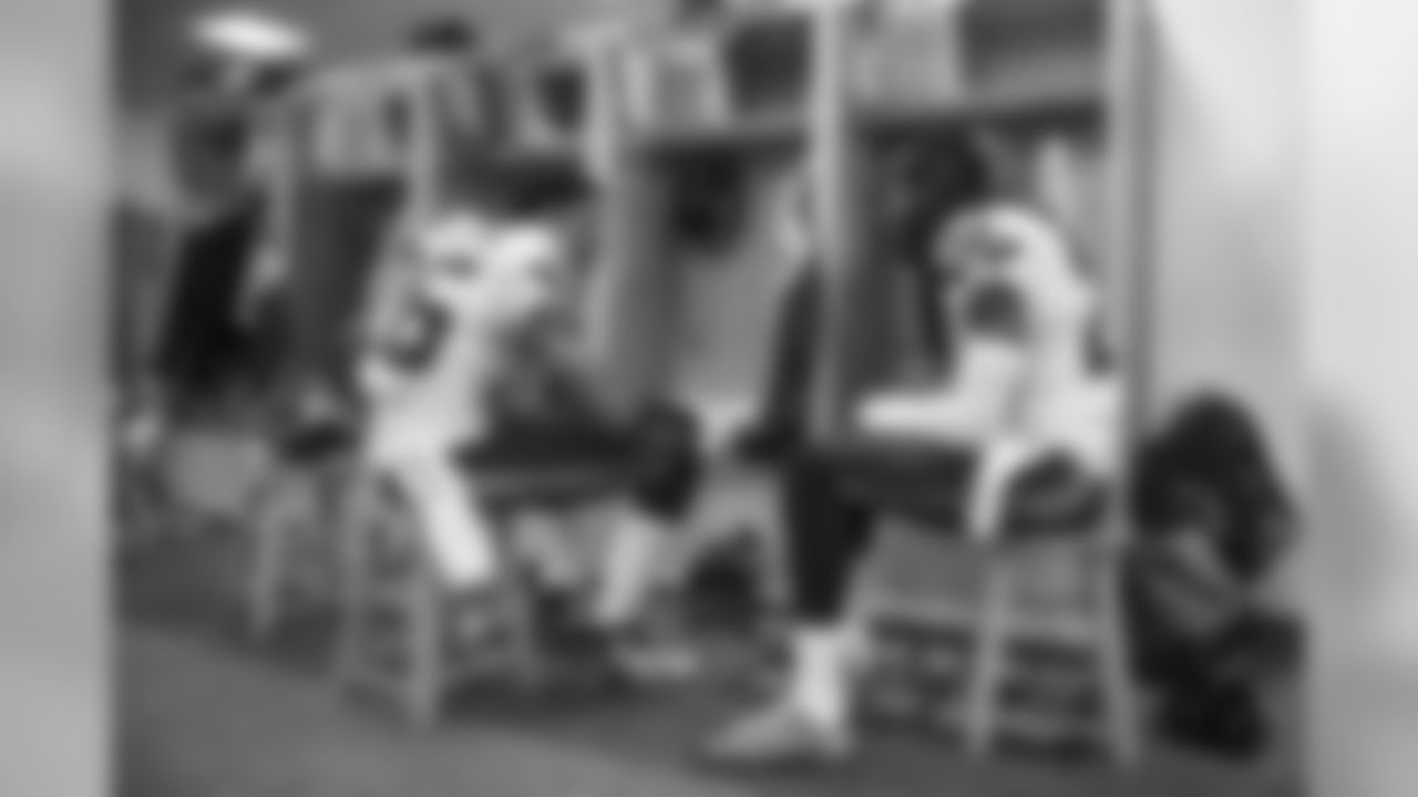 30 minutes before kickoff, cornerbacks Cary Williams and Richard Sherman confer near their lockers.