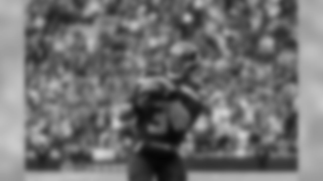 Seahawks quarterback Russell Wilson catches a pass from receiver Doug Baldwin on a trick play in the third quarter.