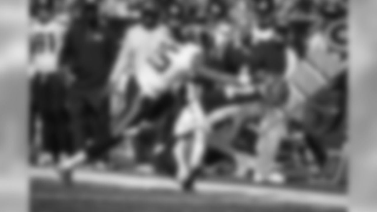 Cornerback Richard Sherman puts a hard hit onto Cincinnati's Marvin Jones along the Seahawks sideline.
