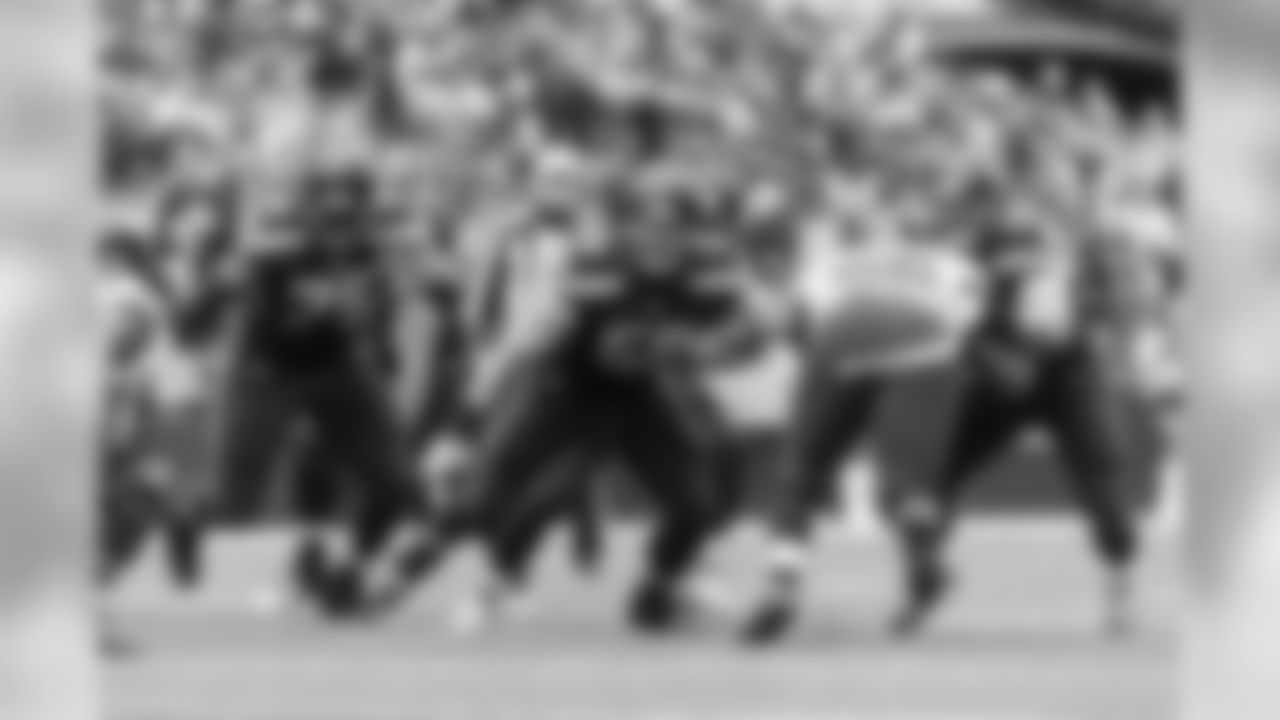 Seattle's offensive line including Germaine Ifedi, Justin Britt and Mark Glowinski block for running back Thomas Rawls.