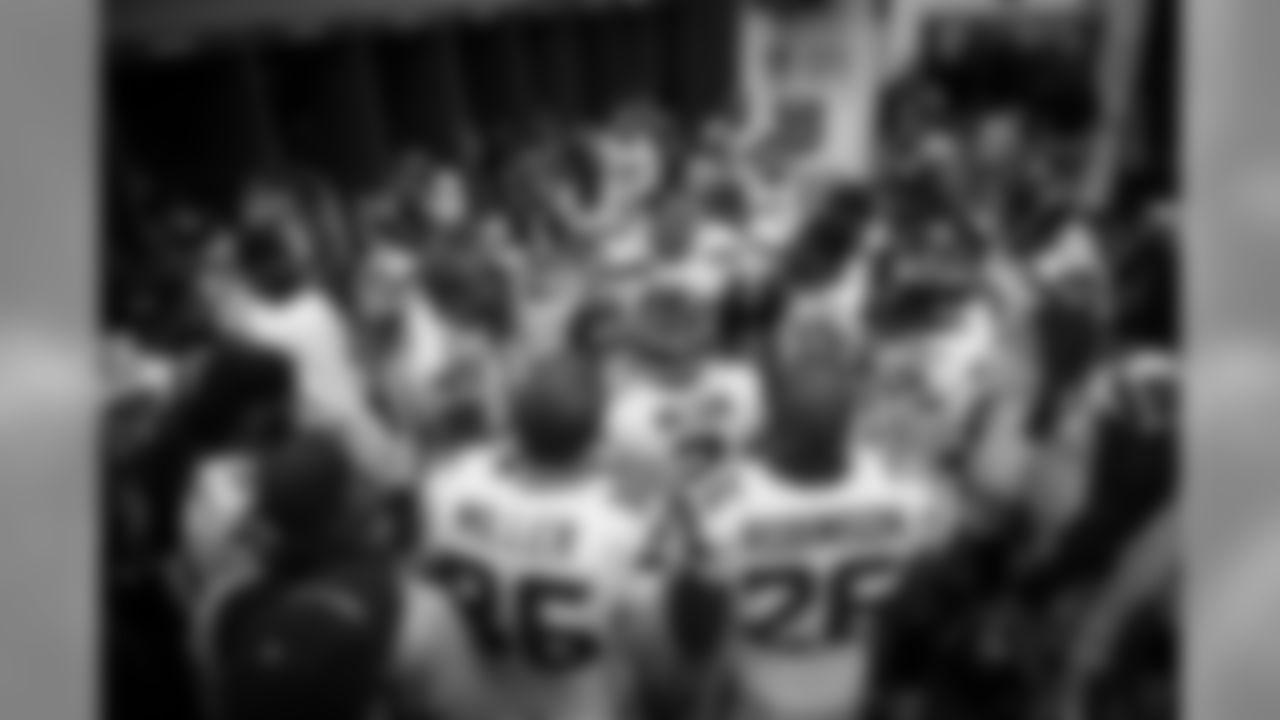 Defensive captain Red Bryant gathers the team around him in the visitors locker room just before the Seahawks take the field.
