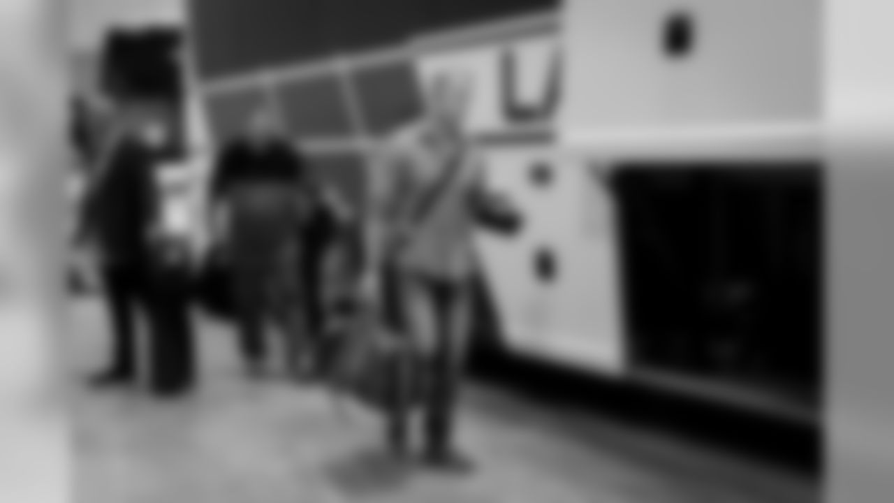 On Sunday, Jon Ryan heads to the bus for the trip to the game.