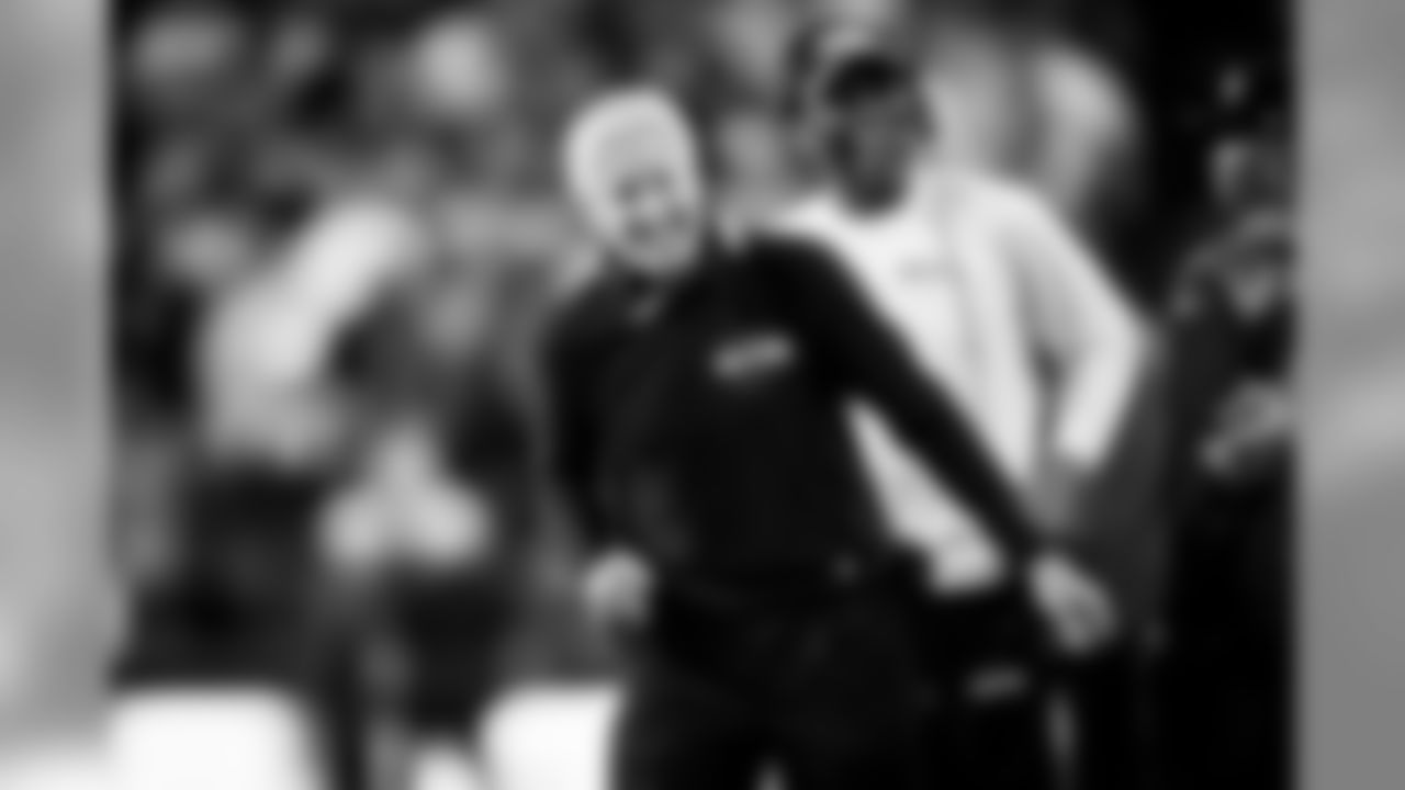 Seahawks head coach Pete Carroll, flanked by running backs coach Sherman Smith, is all smiles in the fourth quarter.