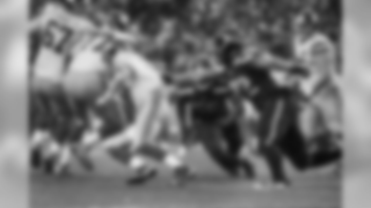 Defensive end Michael Bennett grabs hold of New York quarterback Eli Manning for a sack in the fourth quarter. Seattle's defense shut out the Giants in the second half.