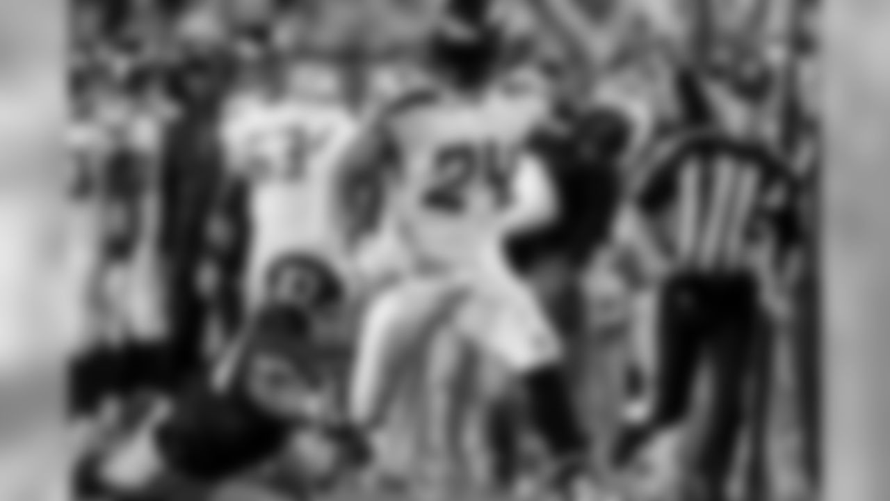 Seattle's Marshawn Lynch looks to cut back inside to keep the clock alive and find more yards after catching a makeshift lob pass from quarterback Russell Wilson. Seattle gained 30 yards and a key first down on the play.